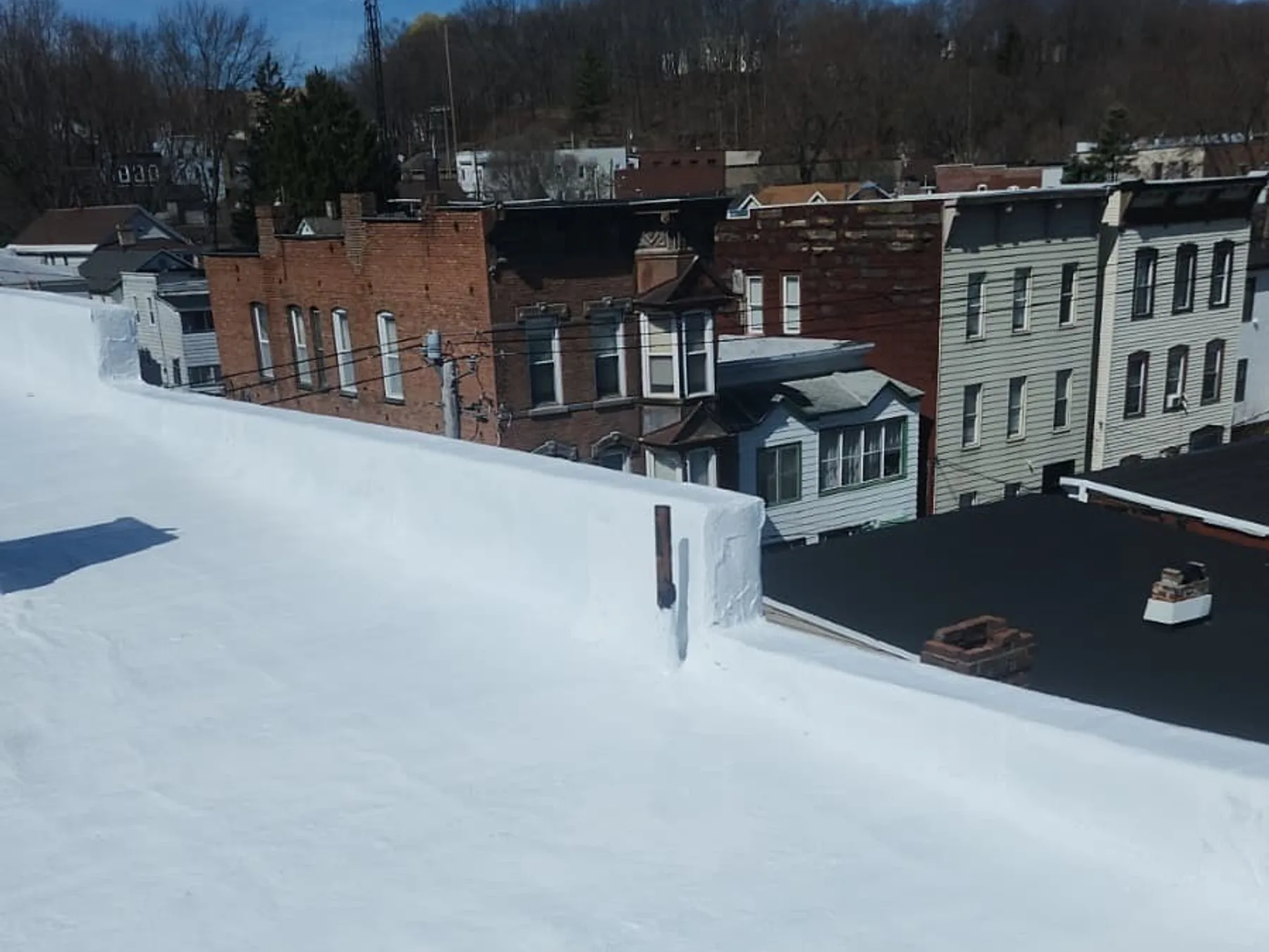 Welded EPDM membrane seams and parapet flashing on a commercial flat roof